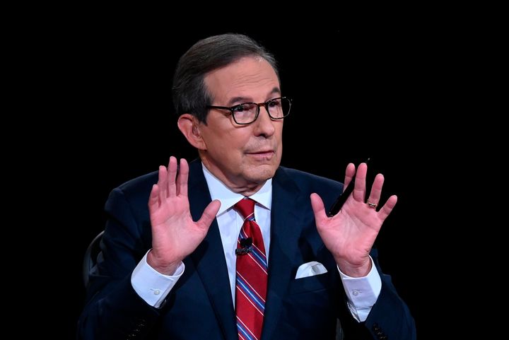 Chris Wallace of Fox News speaks as Donald Trump and Joe Biden participate in the first presidential debate.