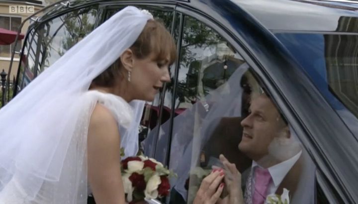 Rainie and Stuart married through a car window on EastEnders