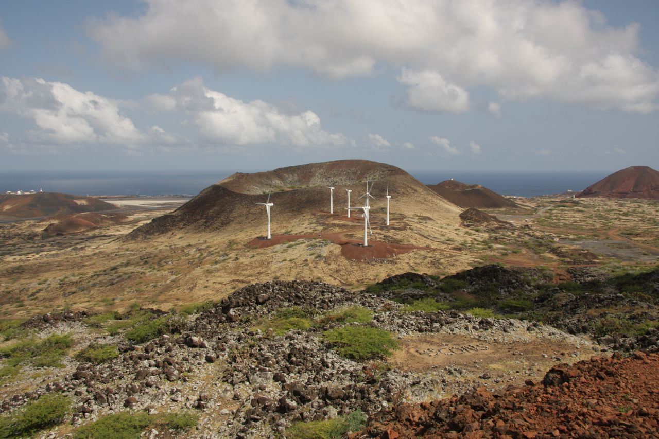 Wind turbines on Ascension Island in South Atlantic Ocean with Wideawake Airfield in background