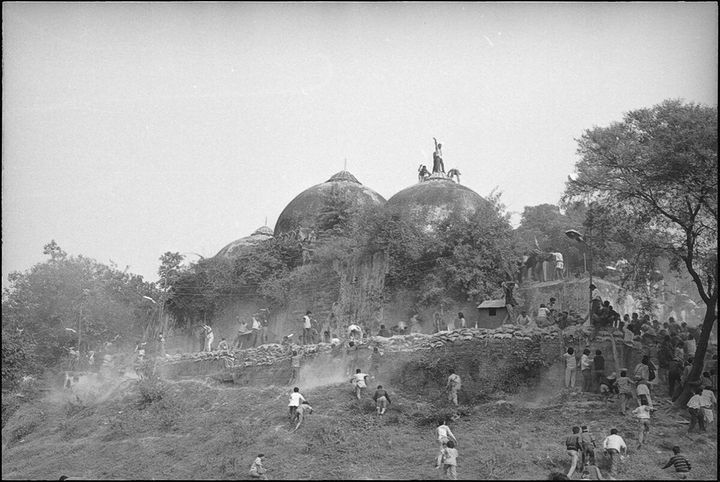 Karsevaks atop the Babri masjid shortly before it was demolished on December 6, 1992 at Ayodhya (Photo by Sanjay Sharma/Hindustan Times via Getty Images)