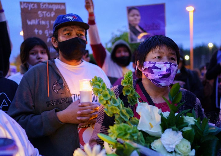 Joyce Echaquan's husband Carol Dubé and mother Diane Echaquan attend a candlelight vigil in front of the Joliette, Que. hospital where she died.