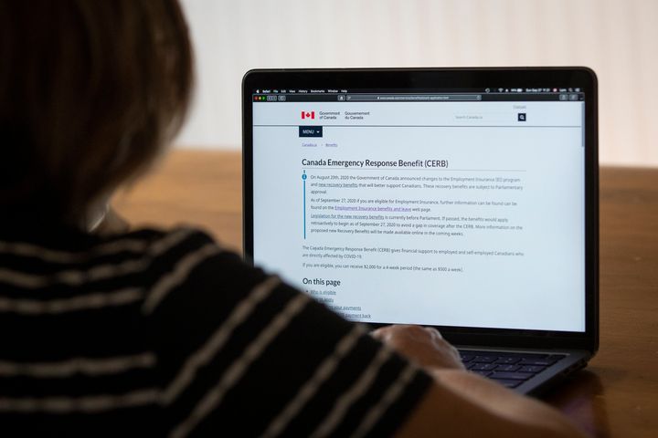 A person looks at the website for the Canada Emergency Response Benefit (CERB) in Kingston, Ontario on Sept. 27, 2020. 