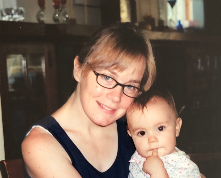 Berdahl, here with one her children, expresses no regret over her family's move. "The U.S. used to hold a lot of esteem in th