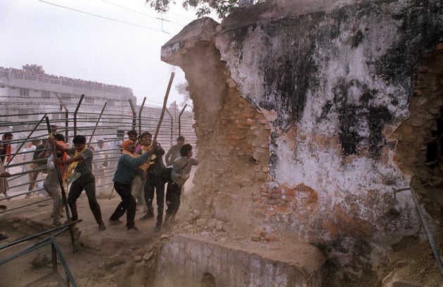 In this December 6, 1992 photograph, Hindu mob attacks the wall of the 16th century Babri Masjid Mosque...