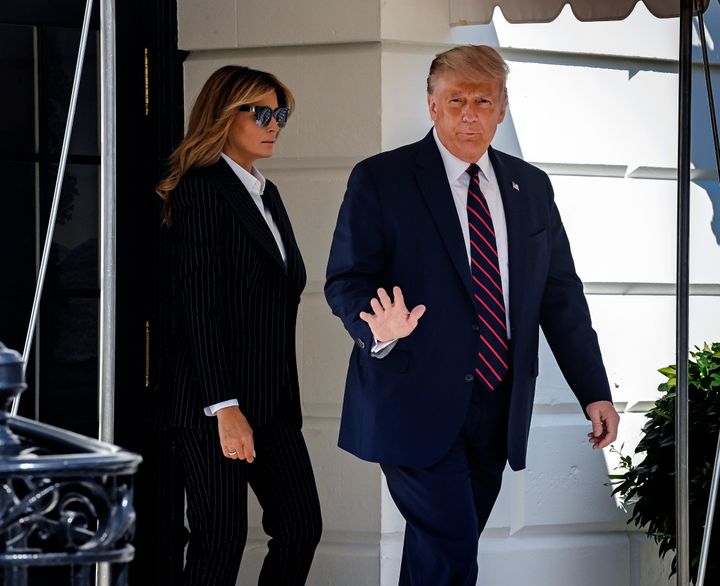 Donald Trump departs the White House with First Lady Melania, in Washington, DC on September 29.