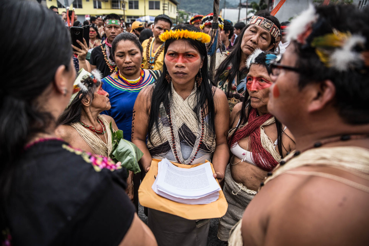 Nemonte Nenquimo holds the Waorani people's written demands to stop oil extraction in their territory at a February 2019 protest in Puyo, Ecuador.