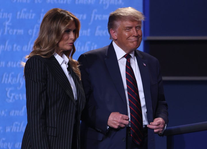 US President Donald Trump and first lady Melania Trump smile on stage after the first presidential debate between Trump and Democratic presidential nominee Joe Biden at the Health Education Campus of Case Western Reserve University on September 29, 2020 in Cleveland, Ohio. 