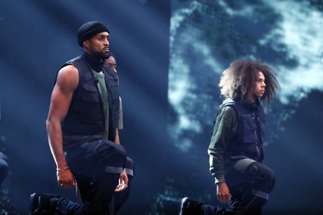 Ashley takes a knee with his fellow Diversity dancers during their BGT performance