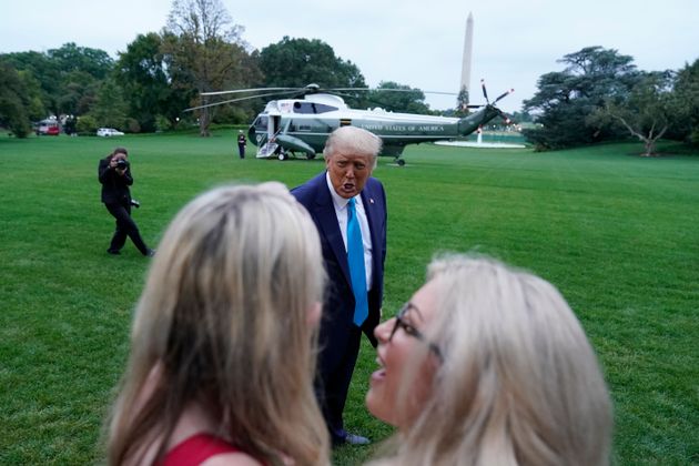 President Trump addresses two unknown women on the South Lawn of the White House