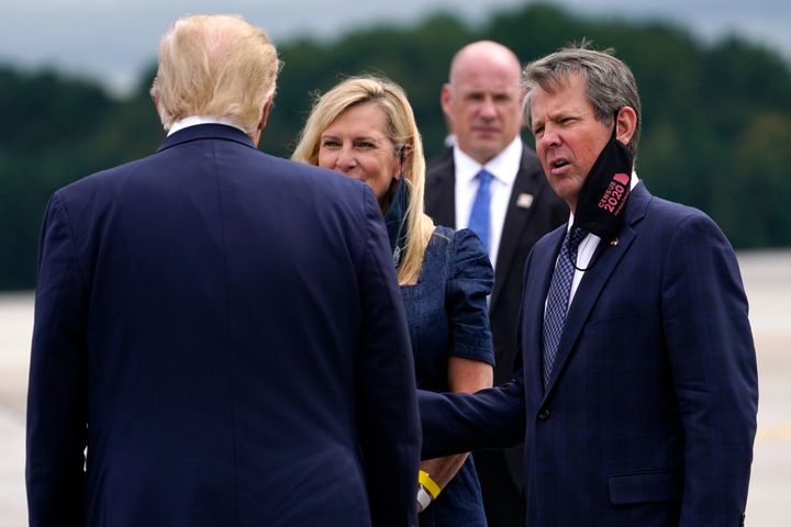 President Trump greets Georgia Governor Brian Kemp and his wife Marty also at the Cobb Galleria Centre