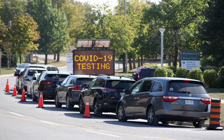 Cars line up for drive-thru COVID-19 testing at the Credit Valley Hospital in Mississauga, Ont., on Sept. 23, 2020.