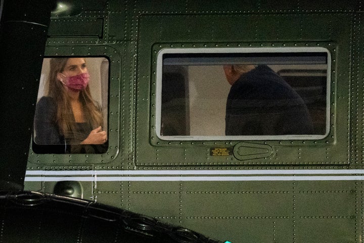 Hope Hicks, left, is seated across President Donald Trump inside Marine One as it lands on the South Lawn at the White House, Monday, Sept. 14, 2020, in Washington.