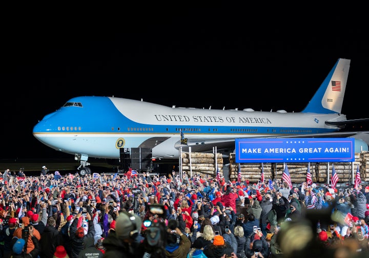 The crowd cheers as Air Force One arrives with President Donald Trump at Duluth International Airport on Wednesday, Sept. 30, for Trump's campaign appearance in Duluth, Minnesota.