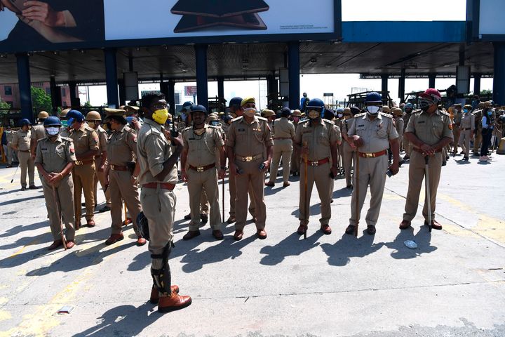Uttar Pradesh Police personnel stand guard at the DND Flyway in New Delhi on October 3, 2020.