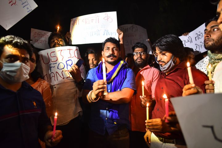 Chandrashekhar Azad, Chief of Bhim Army, lights a candle during a protest against the alleged rape of a 19-year-old woman in Hathras who died, at Safdarjung Hospital on September 29, 2020 in New Delhi.
