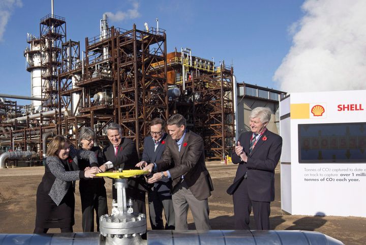 Royal Dutch Shell and other oil company executives and then-Alberta energy minister Marg McCuaig-Boyd (left) open the valve to a carbon capture and storage facility in Fort Saskatchewan, Alta., on Nov. 6, 2015.