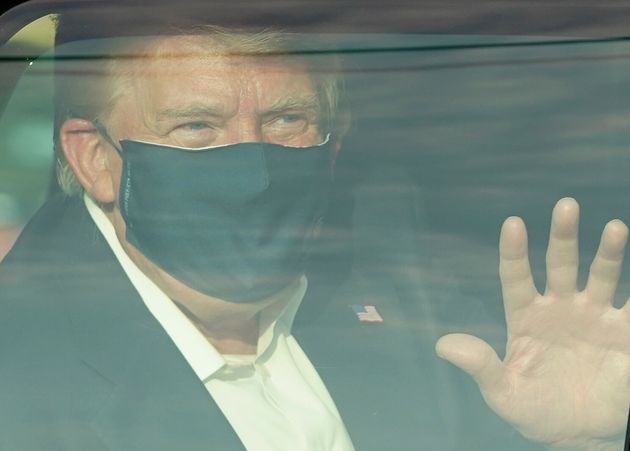 Trump drives past supporters in a motorcade outside of Walter Reed Medical Centre