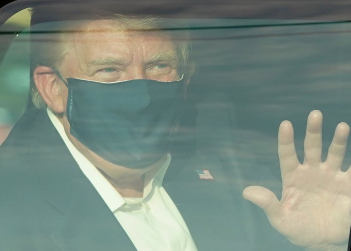 Trump drives past supporters in a motorcade outside of Walter Reed Medical Centre