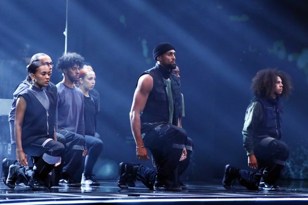 Ashley and his fellow Diversity performers taking a knee during their routine