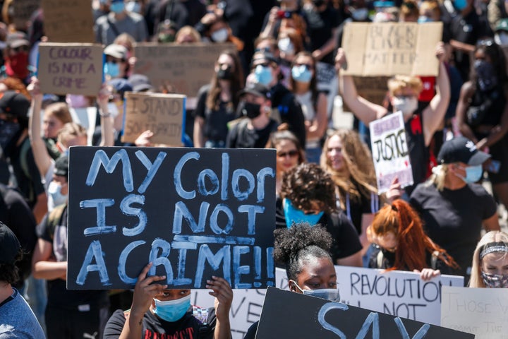 Protesters in Calgary demonstrate in solidarity with with the George Floyd protests across the United States on June 3, 2020.