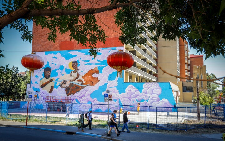 "The Guide and Protector" in progress on Sept. 10, 2020. The mural is across the street from Calgary Chinese Cultural Centre.