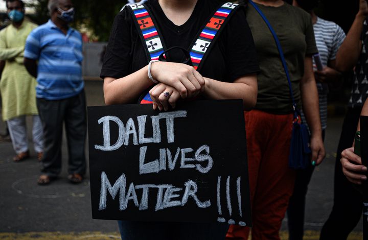 A demonstrator with a placard that reads "Dalit Lives Matter" in a protest against the Hathras incident at Jantar Mantar, on October 4, 2020 in New Delhi.