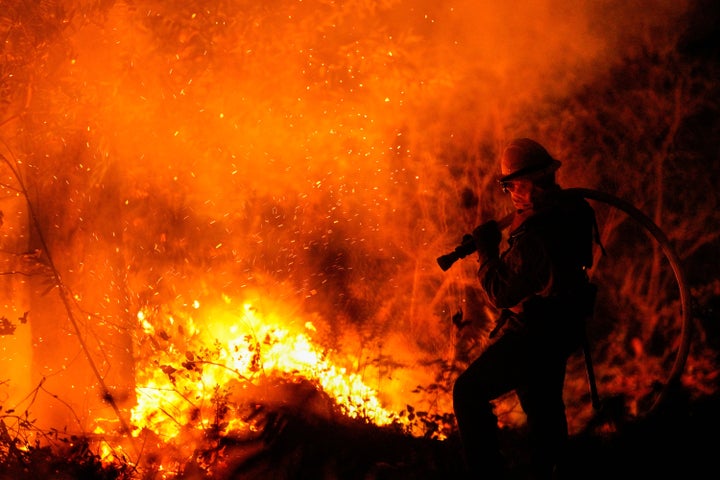 CALISTOGA, CA - OCTOBER 01: Firefighters perform structure protection against the Glass Fire in Napa County along CA-29 just past Old Lawley Toll Rd on Thursday, Oct. 1, 2020 in Calistoga, CA.