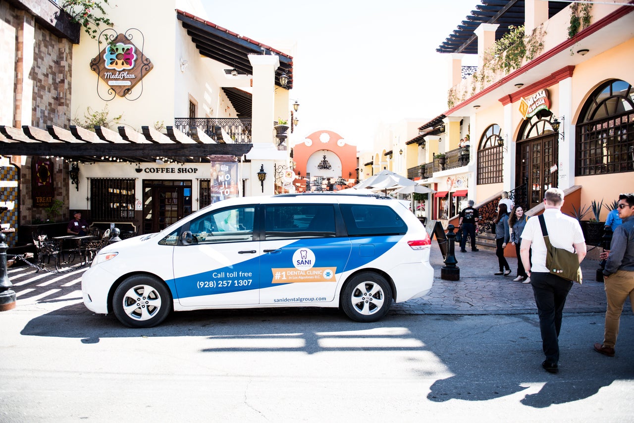 The Sani Dental Group's shuttle was a common sight throughout Los Algadones, aka "Molar City." Here, it is parked outside a busy medical plaza in 2019.