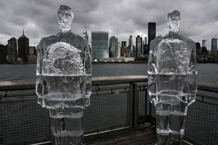 Two ice sculptures depicting U.S. President Donald Trump and Brazilian President Jair Bolsonaro sit across the Hudson River from the United Nations headquarters in New York City on Sept. 30, 2020.