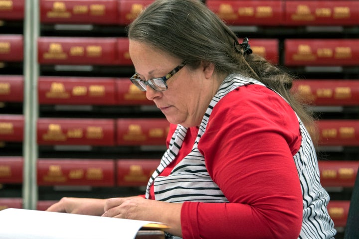 FILE - In this Nov. 6, 2018, file photo, Kim Davis, the county clerk for Rowan County in Kentucky, works with the county election board on Election Day, in Morehead, Ky. This one of the top stories in Kentucky in 2018. (AP Photo/John Flavell, File)