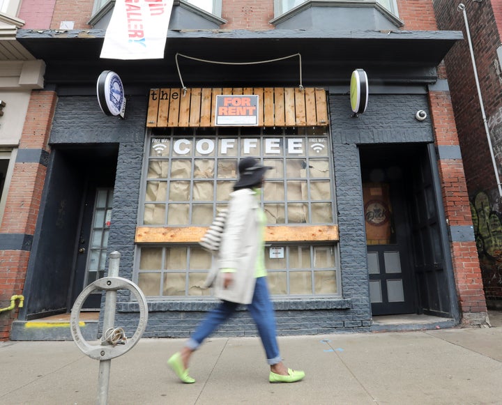 A shuttered coffee shop on Queen Street East in Toronto is seen on May 15, 2020.