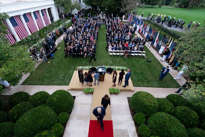 Judge Amy Coney Barrett stands with her family on stage Sept. 26 after a White House news conference at which President Donald Trump announced her as his nominee to the Supreme Court. Several people who attended the gathering have since tested positive for the coronavirus, including the president.