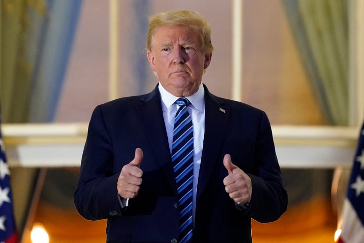 Trump entered the White House without wearing a mask after traveling home from the Walter Reed National Military Medical Cent