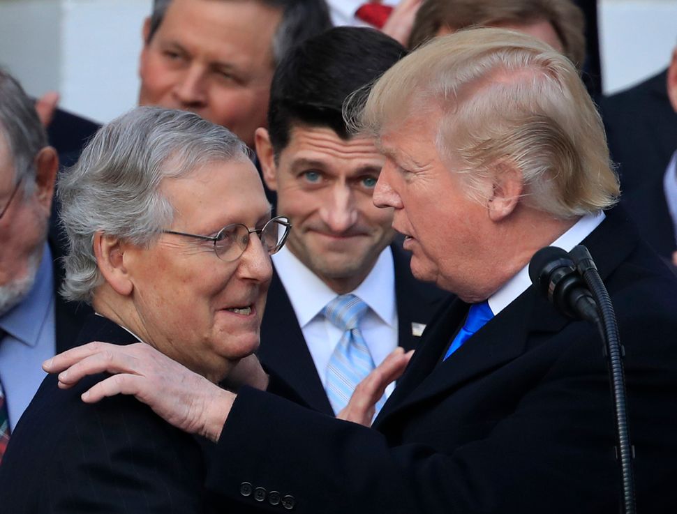 Left to right: Senate Majority Leader Mitch McConnell (R-Ky.), House Speaker Paul Ryan (R-Wis.) and President Donald Trump lo