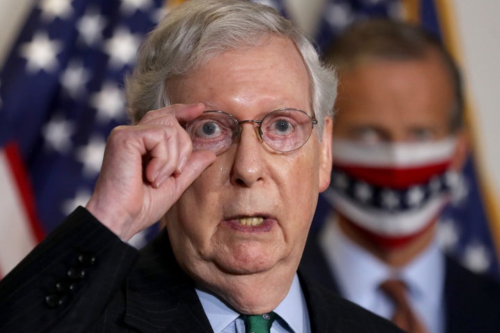 Senate Majority Leader Mitch McConnell (R-Ky.) talks to reporters on Capitol Hill on Sept. 30.