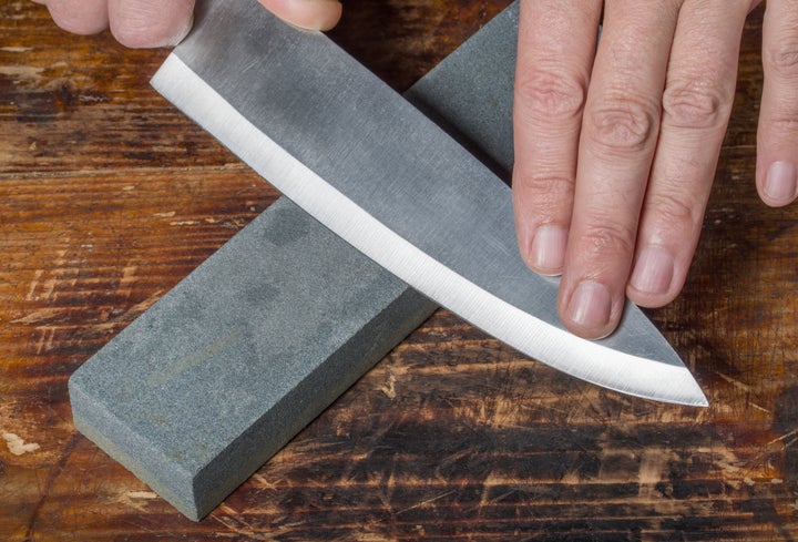 A whetstone is the ideal tool for sharpening the blade of a chef's knife.