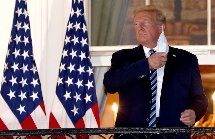 President Donald Trump made a point of removing his mask upon returning to the White House Monday night after being hospitalized for three days with COVID-19 -- continuing his pattern of discounting the seriousness of a pandemic thet has now killed more then 210,000 people in America.