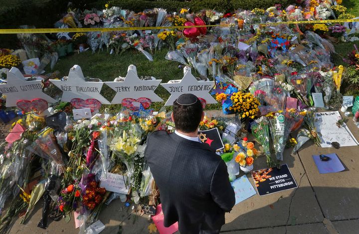 A man prays at a makeshift memorial outside the Tree of Life synagogue in Pittsburgh, Pennsylvania, Oct. 31, 2018, after a white nationalist massacred worshippers there. 