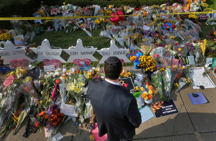 A man prays at a makeshift memorial outside the Tree of Life synagogue in Pittsburgh, Pennsylvania, Oct. 31, 2018, after a wh