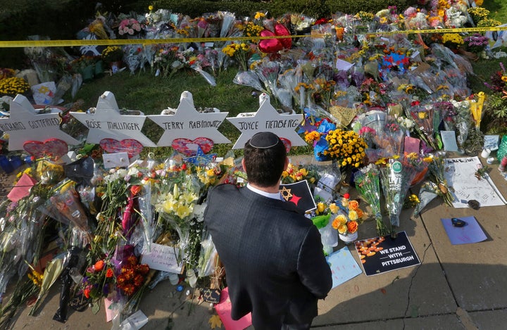 A man prays at a makeshift memorial outside the Tree of Life synagogue in Pittsburgh, Pennsylvania, Oct. 31, 2018, after a white nationalist massacred worshippers there. 