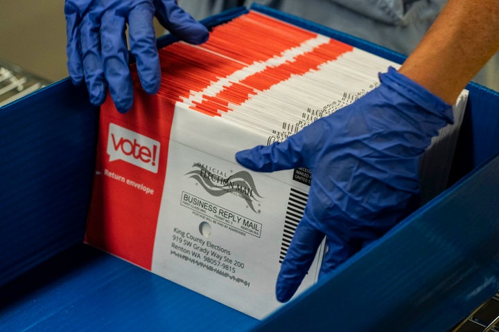 An elections worker sorts unopened ballots at the King County Elections headquarters on Aug. 4 in Renton, Washington. In Washington state, voting is done almost exclusively by mail.