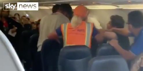 Video taken Saturday aboard an Allegiant Air flight from Arizona to Utah shows a man choking another passenger who refused to wear a mask.