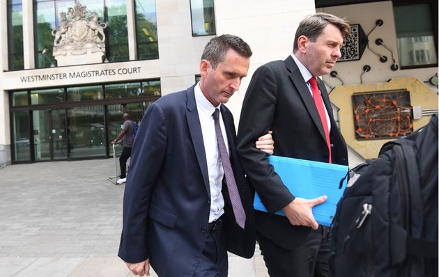 Lord Holmes of Richmond (left) leaving Westminster Magistrates' Court, London where he appeared on charges of sexual assault