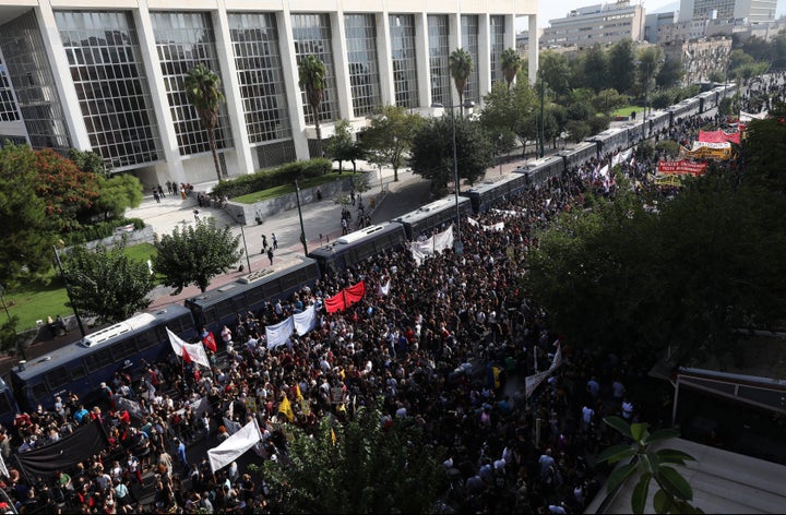 Thousands of people gather for a protest outside a court in Athens, Wednesday, Oct. 7, 2020.