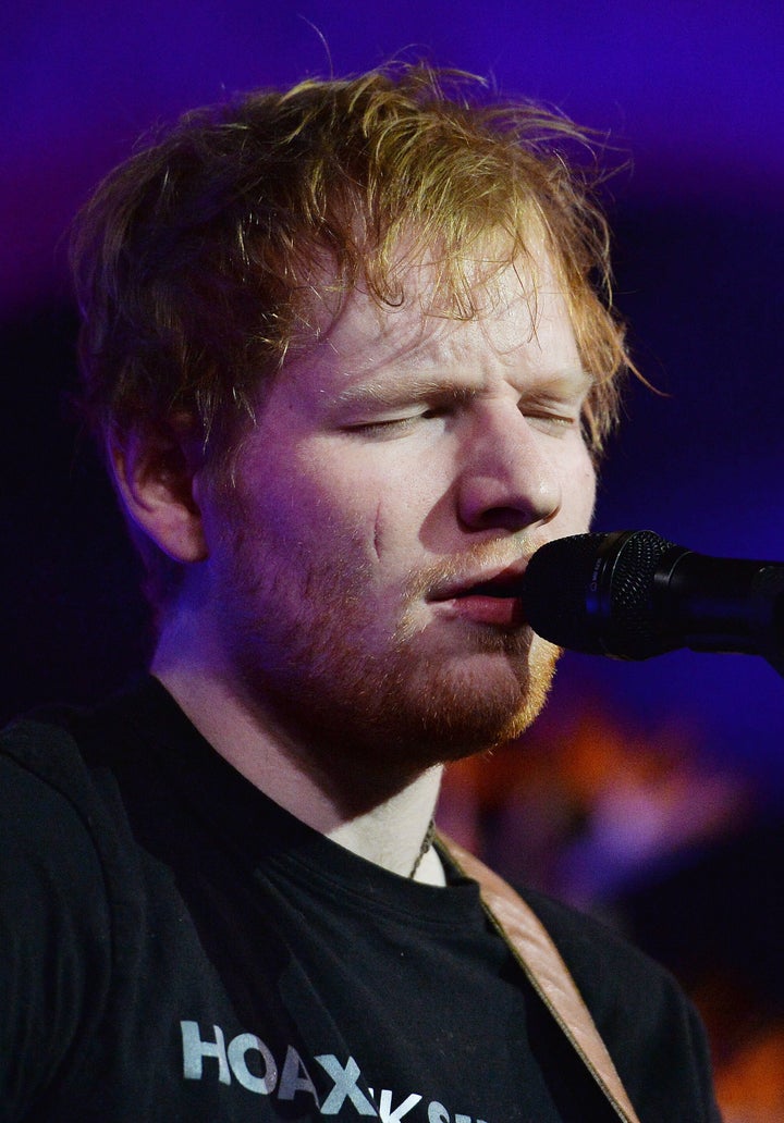 Ed Sheeran performs at East Anglia's Children's Hospices gala dinner in London in 2016, where his scar still looks recent. 