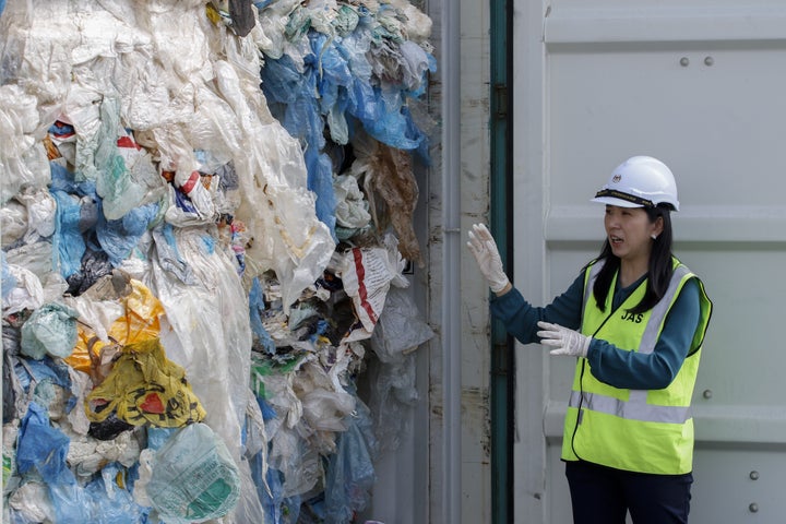 Malaysia's minister of energy, science, technology, environment and climate change Yeo Bee Yin shows plastics waste shipment from Canada before sending back to the country of origin in Port Klang on May 28, 2019.