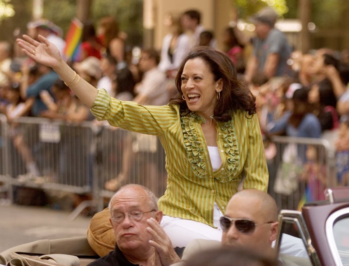 Kamala Harris, top, then San Francisco District Attorney, waves to the crowd during the annual Gay Pride Parade along Market Street in 2009.