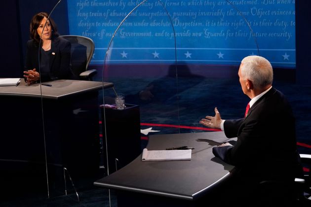 Vice President Mike Pence (Republican Party) debates with Democratic vice presidential candidate Kamala Harris during a televised debate.  Year 2020