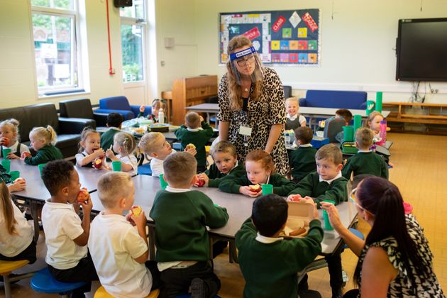 Reception children have their lunch at Woodlands Primary Academy in Oldham, northern England on September 7, 2020. 