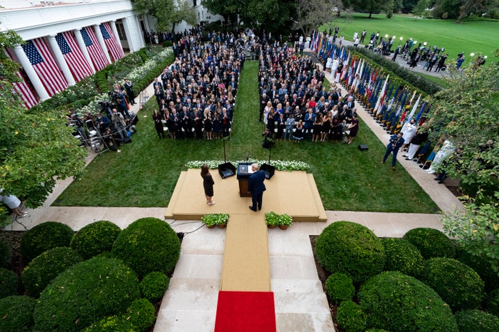 In this Sept. 26, 2020, photo President Donald Trump, center, stands with Judge Amy Coney Barrett as they arrive for a news c